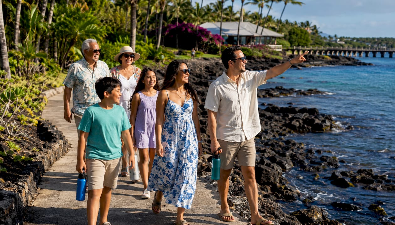 Family walking from Kailua Pier to Kona ride venue
