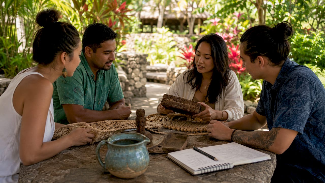 Diverse group engages with cultural artifacts