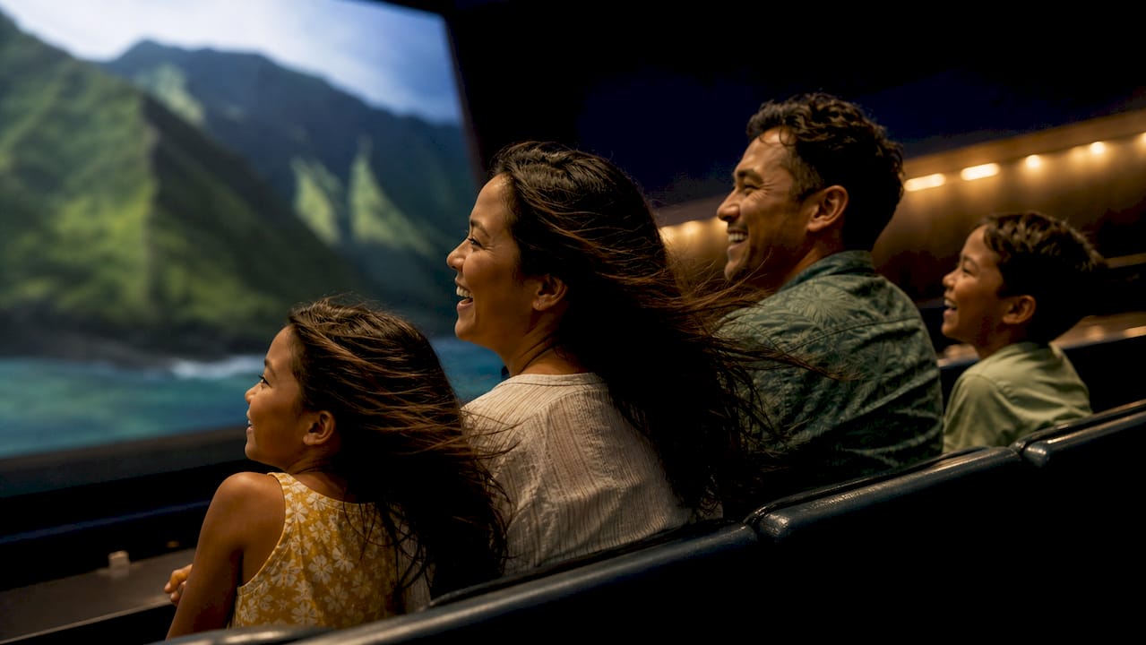 Families enjoying immersive flight theater