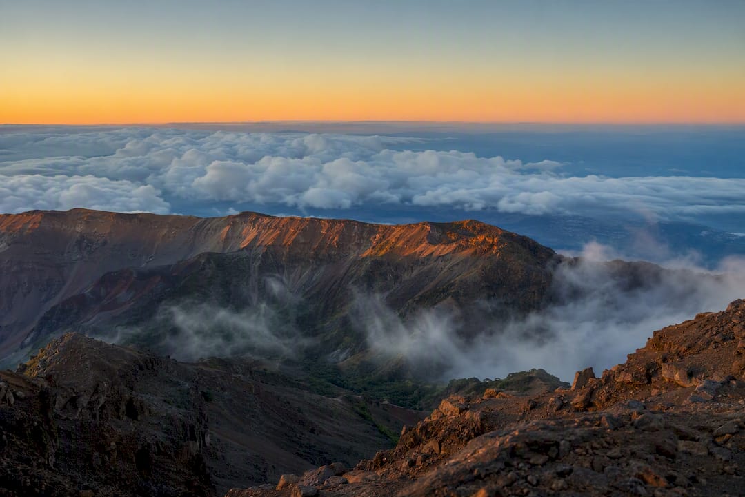 Aerial sunrise view over Maui volcanic summit