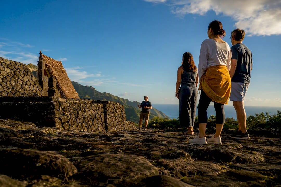 Visitors exploring a preserved Hawaiian heritage site