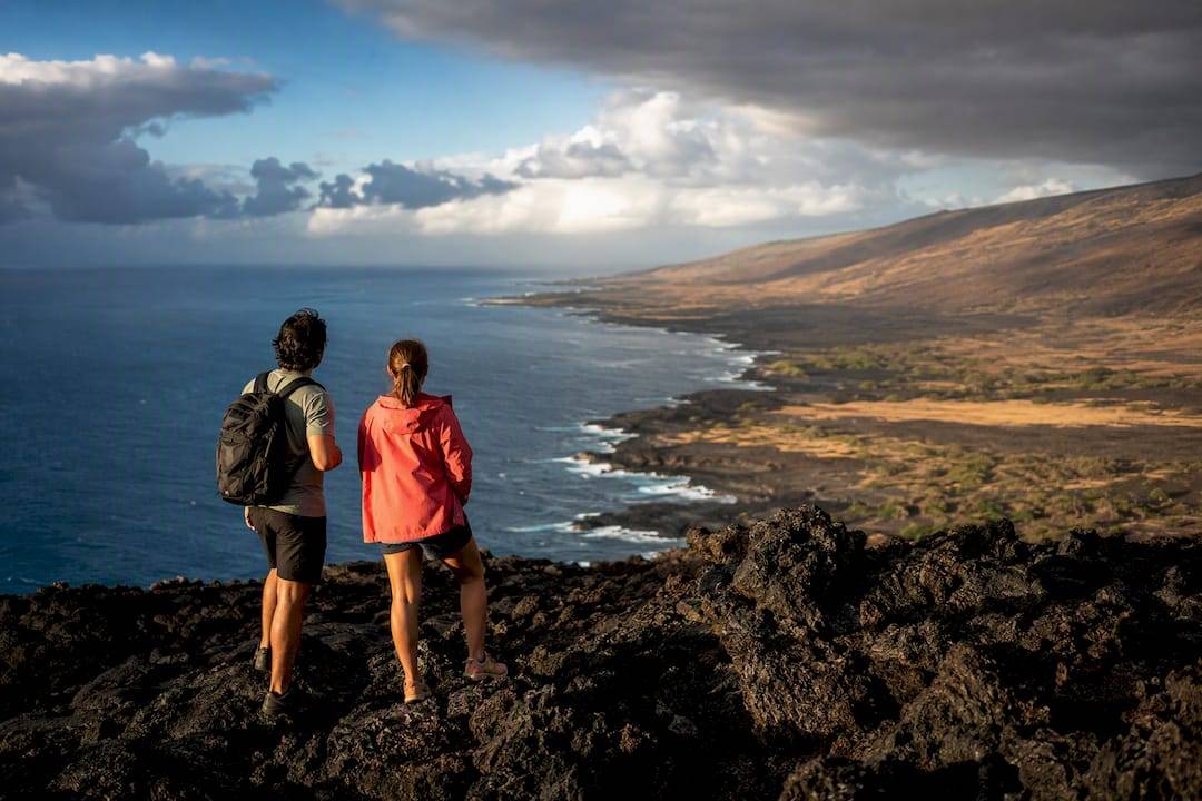 Travelers overlooking Kailua-Kona coastline