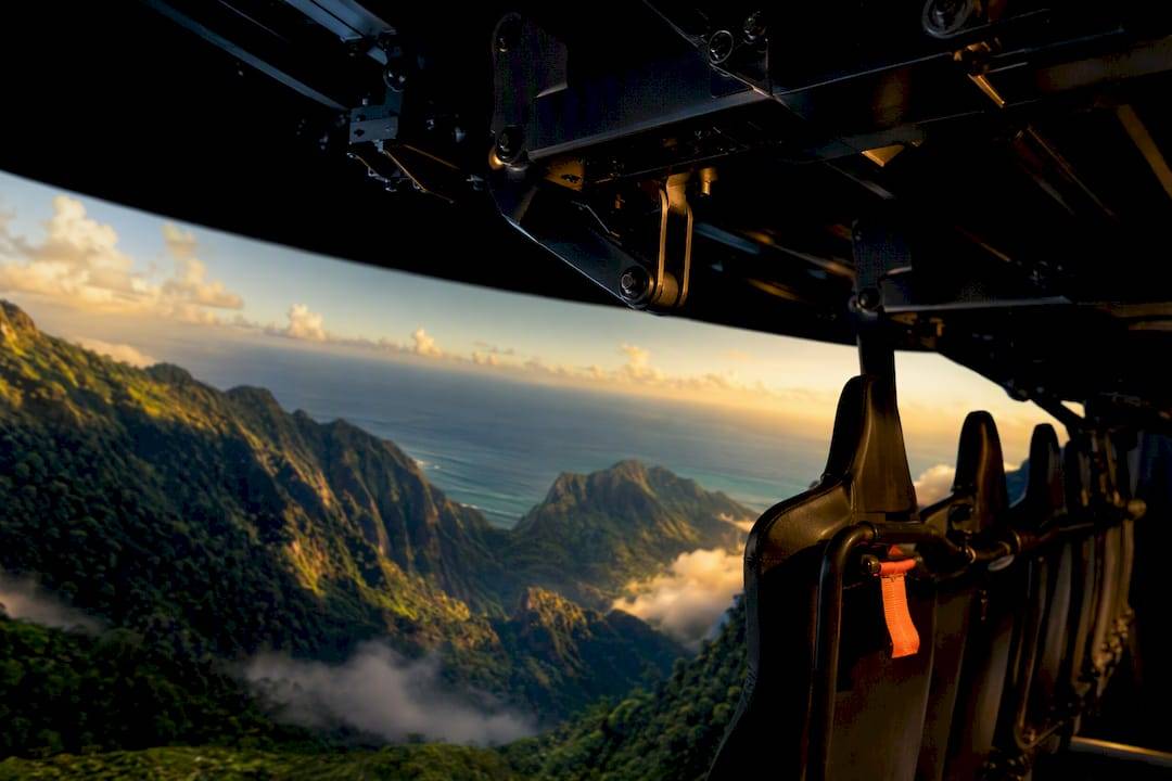Flying theater seats beneath Hawaiian aerial projection
