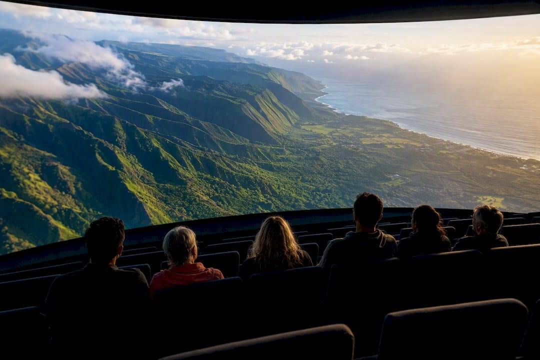 Visitors viewing Hawaiian landscapes in immersive theater