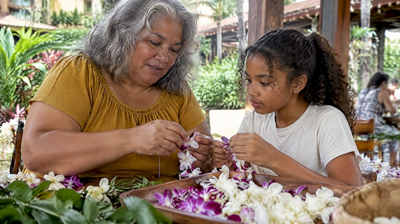 Family learning to make a flower lei