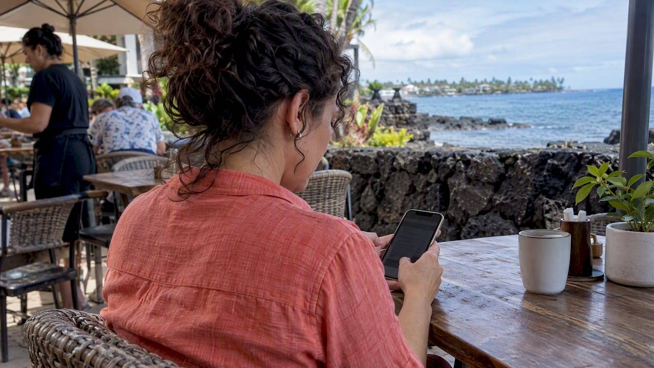 Visitor purchasing attraction tickets on a phone