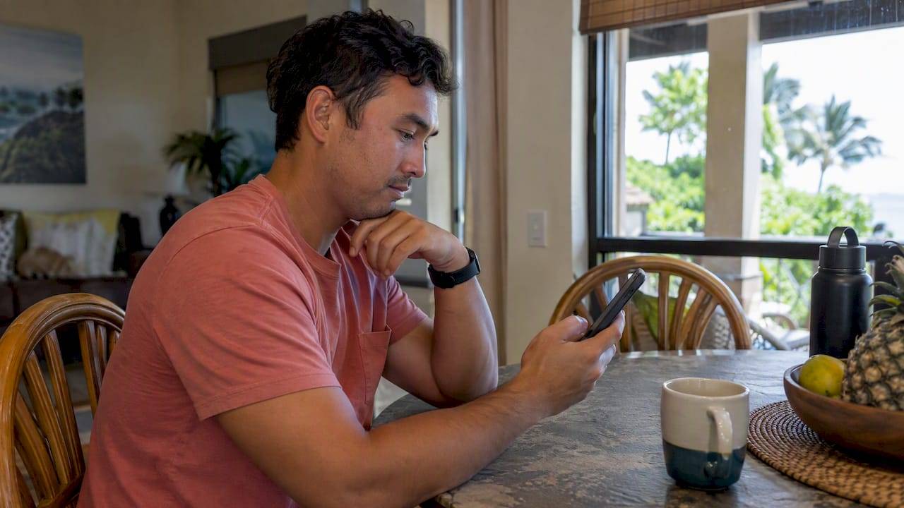 Traveler reviewing an online ticket transfer