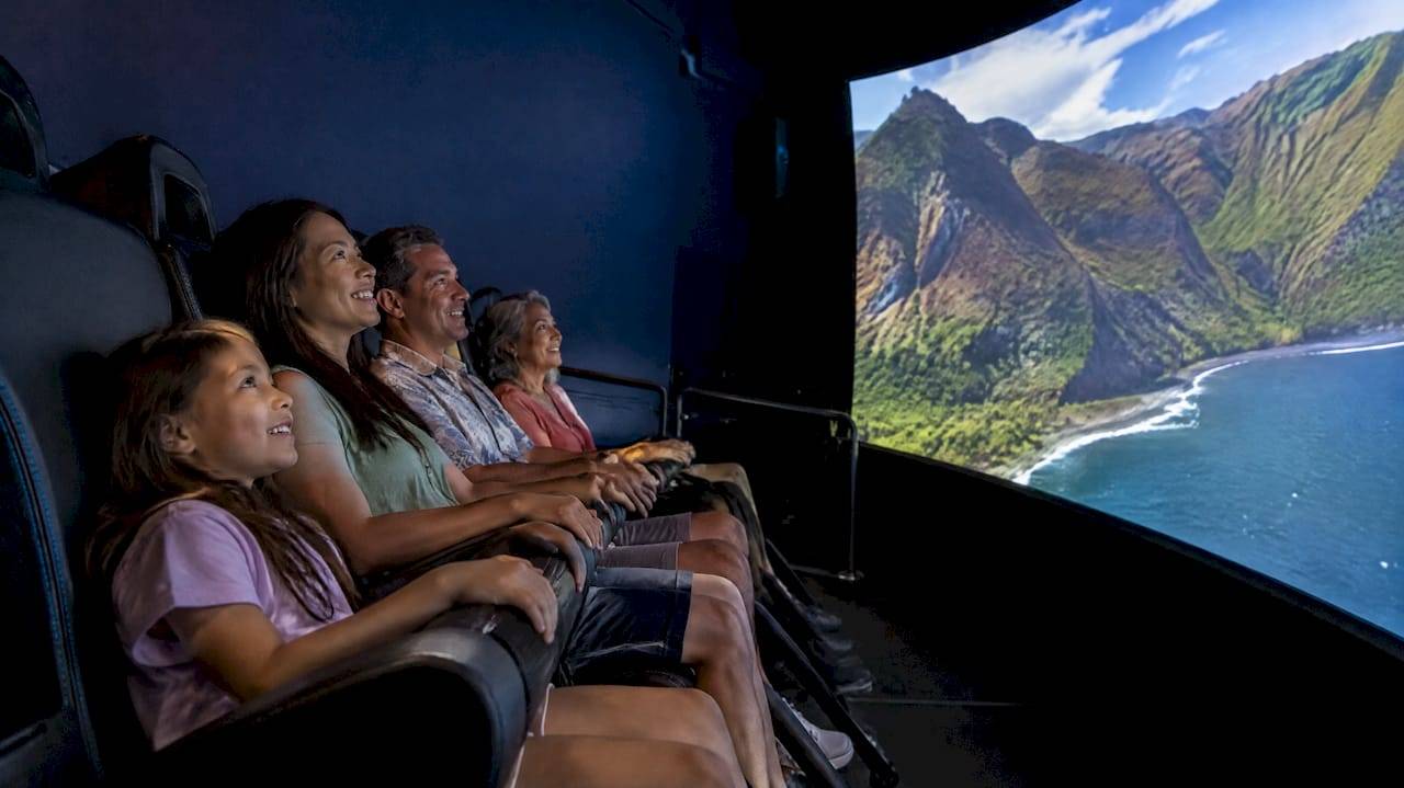 Family experiencing a Hawaiian flying theater ride