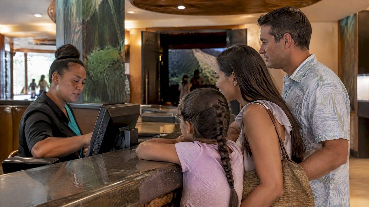 Family choosing tickets at Flight of Aloha