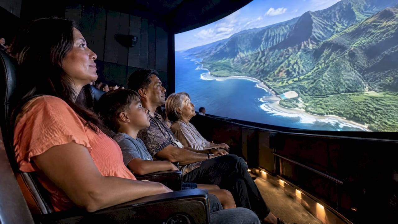 Visitors experiencing Hawaiian cultural flight theater