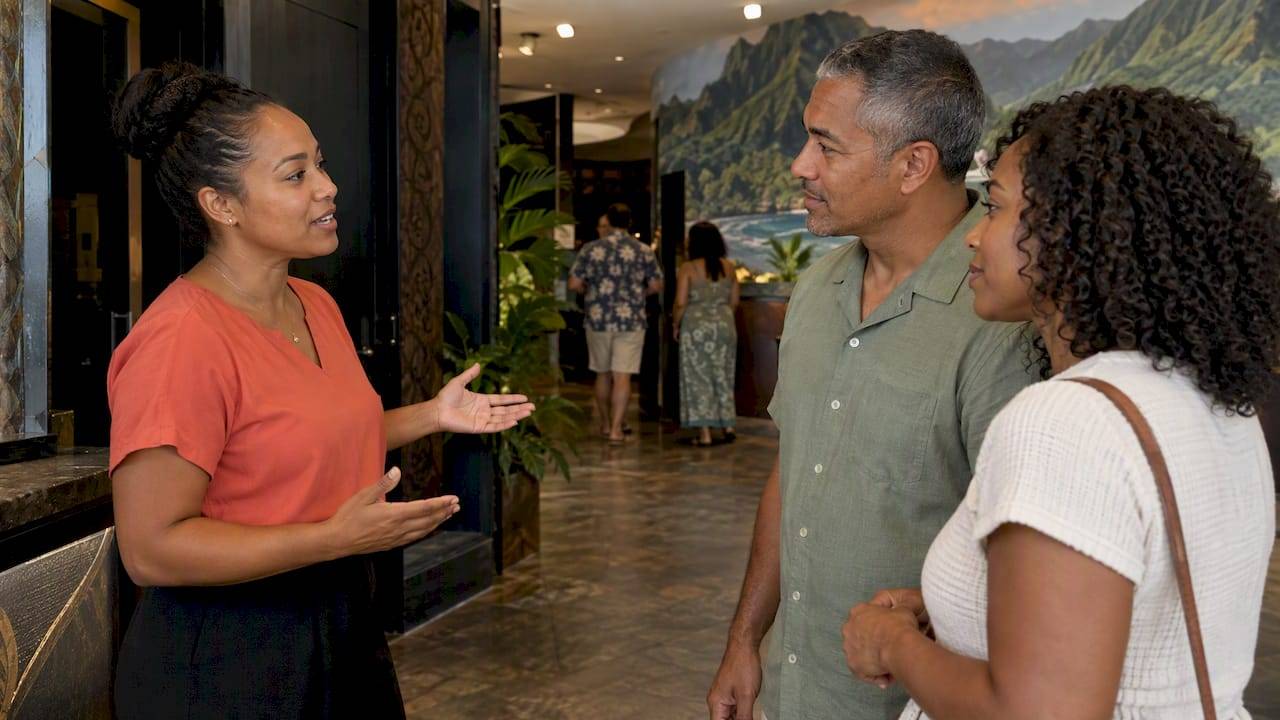 Visitors discuss ticket choices with theater host