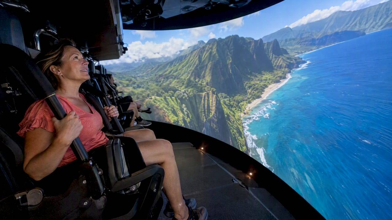 Visitor experiencing Flight of Aloha flight simulator