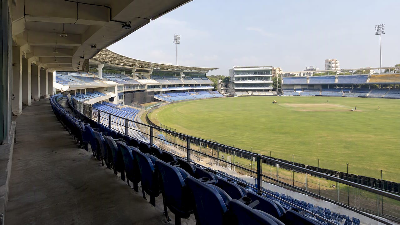 Shaded stadium seats overlooking the cricket pitch